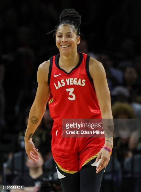 Candace Parker of the Las Vegas Aces reacts after hitting a 3-pointer against the New York Liberty in the third quarter of their preseason game at...