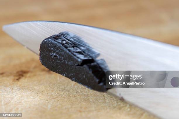 a sliced black garlic clove - rebanada bildbanksfoton och bilder