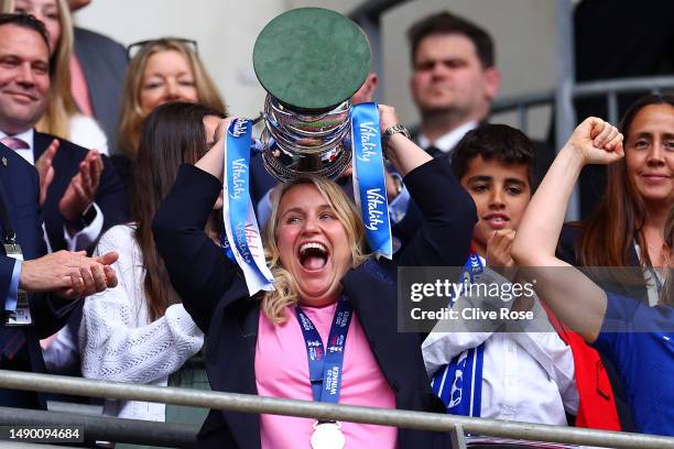 Emma Hayes, Manager of Chelsea, lifts the Vitality Women's FA Cup trophy after the team's victory during the Vitality Women's FA Cup Final between...