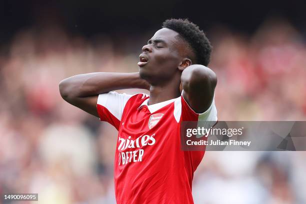Bukayo Saka of Arsenal reacts during the Premier League match between Arsenal FC and Brighton & Hove Albion at Emirates Stadium on May 14, 2023 in...