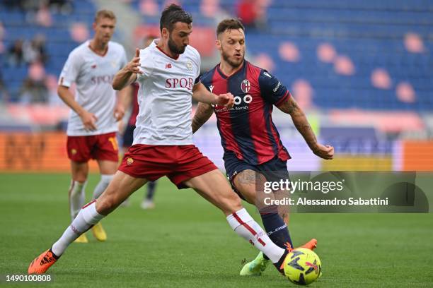 Bryan Cristante of AS Roma competes for the ball with Marko Arnautovic of Bologna FC during the Serie A match between Bologna FC and AS Roma at...