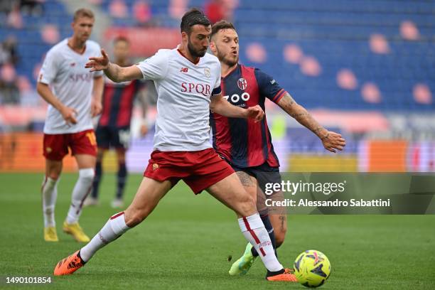 Bryan Cristante of AS Roma competes for the ball with Marko Arnautovic of Bologna FC during the Serie A match between Bologna FC and AS Roma at...