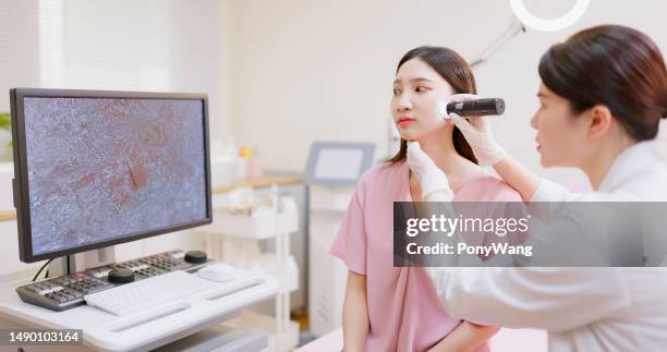 doctor examines skin - dermatologists talking to each other patient stock pictures, royalty-free photos & images