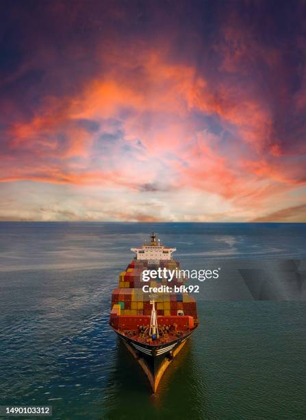 aerial view of container freight ship in transit. - sailing a ship stock pictures, royalty-free photos & images