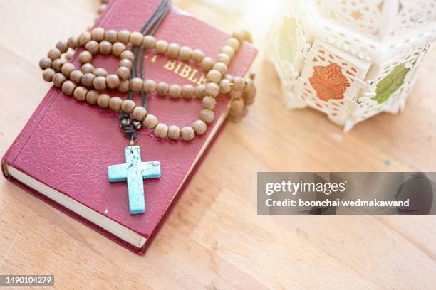 bible and cross. - crucifix stock pictures, royalty-free photos & images