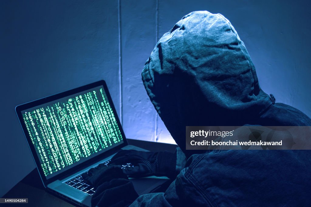 Hacker stealing passwords and identity, computer crime