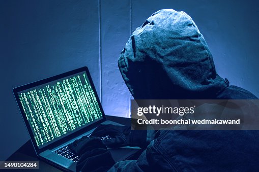 Hacker stealing passwords and identity, computer crime Hacker stealing passwords and identity, computer crime