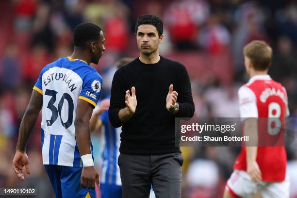 Mikel Arteta, Manager of Arsenal, applauds their fans after their side's defeat to Brighton & Hove Albion during the Premier League match between...