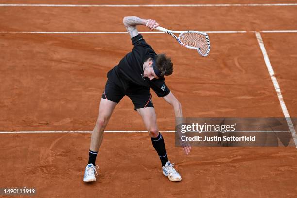 Alexander Bublik of Kazakhstan smashes his racket during his men's singles third round match against Casper Ruud of Norway during day seven of the...