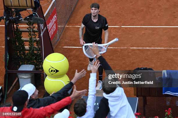 Alexander Bublik of Kazakhstan throws his smashed racket into the crowd during his men's singles third round match against Casper Ruud of Norway...