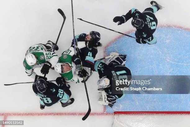 Ty Dellandrea of the Dallas Stars and Justin Schultz of the Seattle Kraken shove each other during the second period in Game Six of the Second Round...