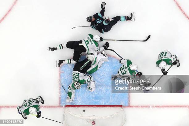Jaden Schwartz of the Seattle Kraken celebrates a goal by Jordan Eberle during the first period against the Dallas Stars in Game Six of the Second...