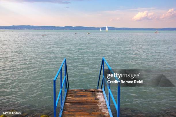 classic beach steps leading into the water on balaton 1 - lake balaton stock pictures, royalty-free photos & images