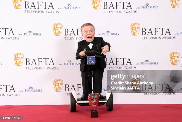 Lenny Rush poses in the Winner's Room with the Male Performance in a Comedy Programme Award for 'Am I Being Unreasonable?' during the 2023 BAFTA...