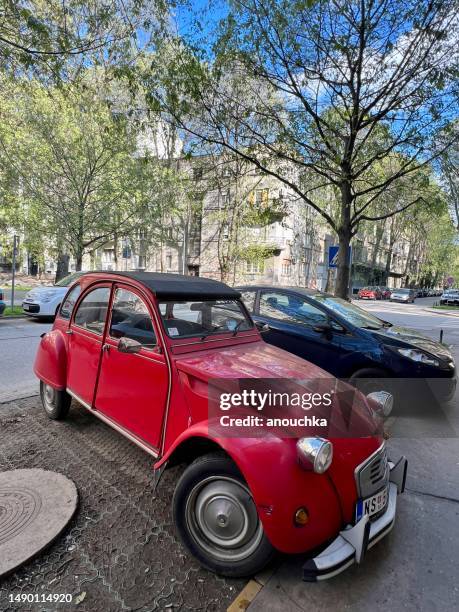 old citroën parked in residential district of belgrade, serbia - citroen deux chevaux stock pictures, royalty-free photos & images