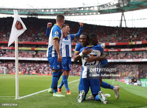 Pervis Estupinan of Brighton & Hove Albion celebrates with teammates after scoring the team's third goal during the Premier League match between...