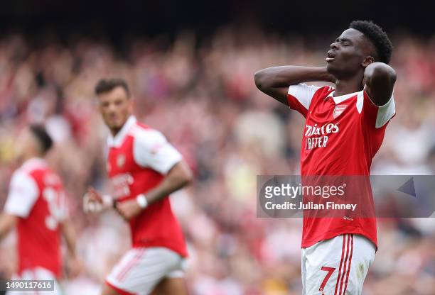 Bukayo Saka of Arsenal looks dejected during the Premier League match between Arsenal FC and Brighton & Hove Albion at Emirates Stadium on May 14,...
