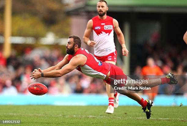 Rhyce Shaw of the Swans dives for the ball during the round 17 AFL match between the Sydney Swans and the St Kilda Saints at the Sydney Cricket...