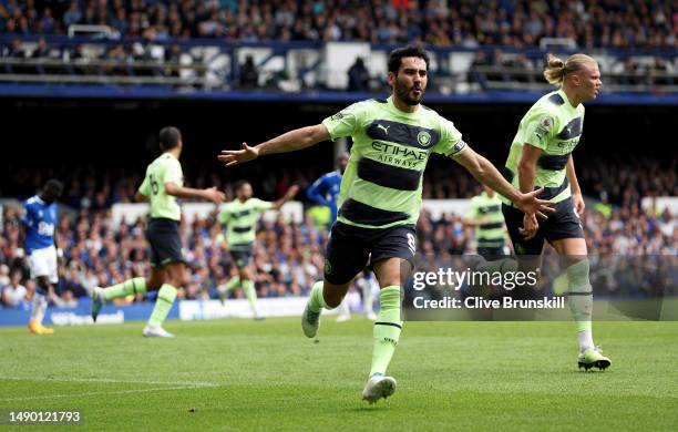 Ilkay Guendogan of Manchester City celebrates with teammate Erling Haaland after scoring the team's first goal during the Premier League match...