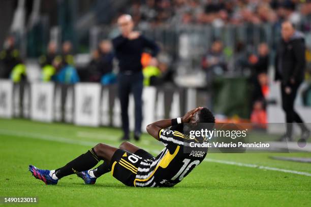 Paul Pogba of Juventus reacts after going down with an injury during the Serie A match between Juventus and US Cremonese at Allianz Stadium on May...