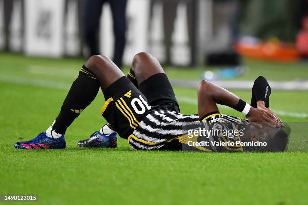 Paul Pogba of Juventus reacts after going down with an injury during the Serie A match between Juventus and US Cremonese at Allianz Stadium on May...