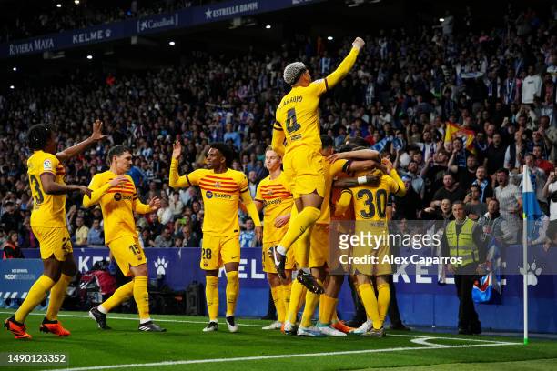 Robert Lewandowski of FC Barcelona celebrates with teammates after scoring the team's first goal during the LaLiga Santander match between RCD...