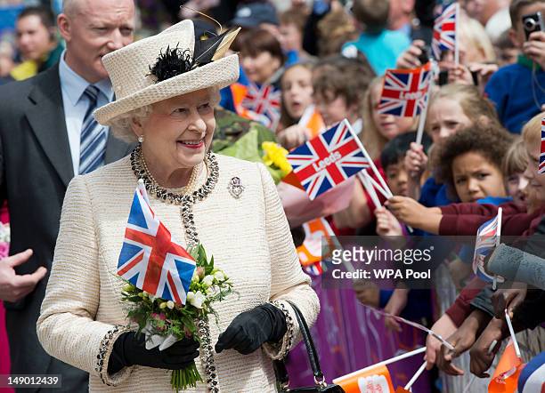 Queen Elizabeth II meets members of the public during a visit to the City Varieties Music Hall where she watched a "Good Old Days" theatrical...