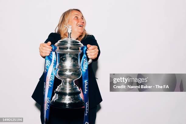 Manager of Chelsea, Emma Hayes, poses with the trophy following her sides victory during the Vitality Women's FA Cup Final match between Chelsea and...