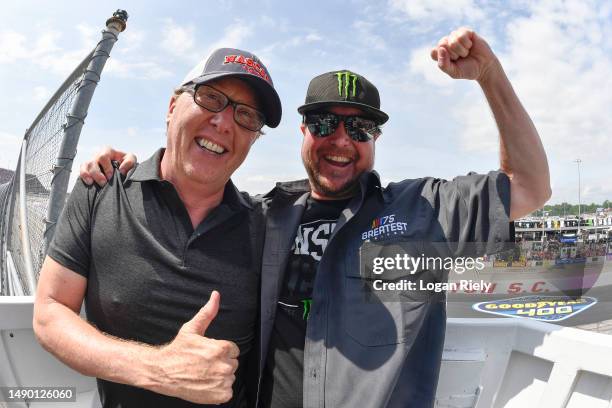 Honorary starters and former NASCAR Cup Series drivers Ricky Craven and Kurt Busch celebrate in the flagstand after the start of the NASCAR Cup...