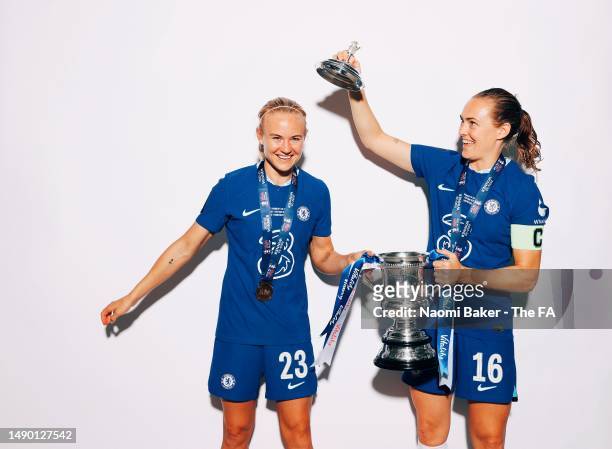 Pernille Harder and Magdalena Eriksson of Chelsea pose with the trophy following their sides victory during the Vitality Women's FA Cup Final match...