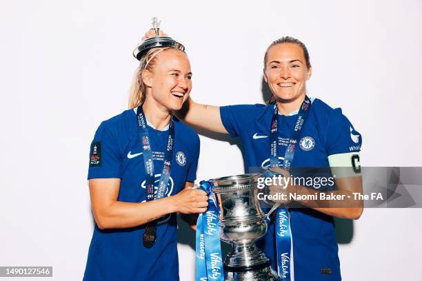 Pernille Harder and Magdalena Eriksson of Chelsea pose with the trophy following their sides victory during the Vitality Women's FA Cup Final match...