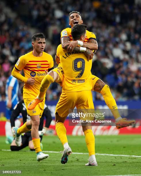 Robert Lewandowski of FC Barcelona celebrates with teammate Raphinha after scoring the team's third goal during the LaLiga Santander match between...