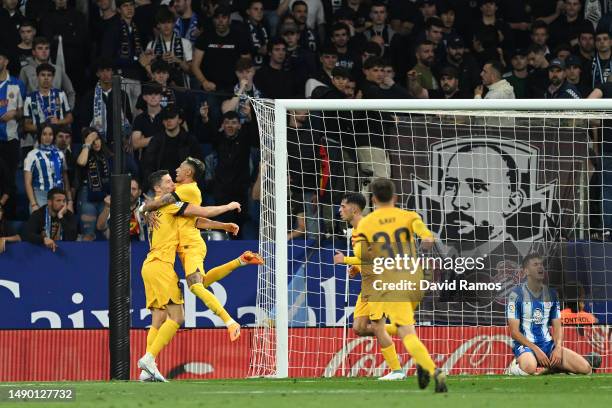 Robert Lewandowski of FC Barcelona celebrates with teammate Raphinha after scoring the team's third goal during the LaLiga Santander match between...