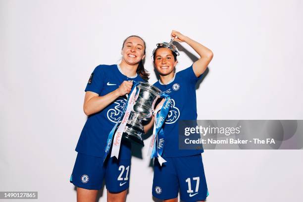 Niamh Charles and Jessie Fleming of Chelsea pose with the trophy following their sides victory during the Vitality Women's FA Cup Final match between...