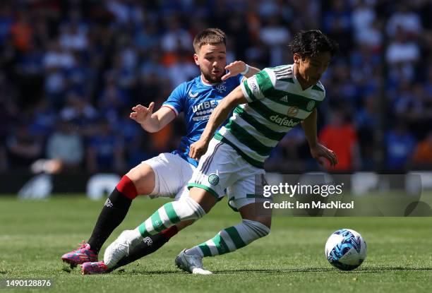 Nicolas Raskin of Rangers vies with Reo Hatate of Celtic during the Cinch Premiership match between Rangers and Celtic at Ibrox Stadium on May 13,...