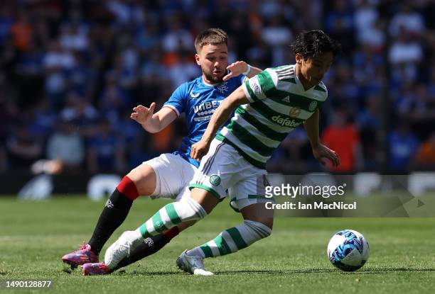 Nicolas Raskin of Rangers vies with Reo Hatate of Celtic during the Cinch Premiership match between Rangers and Celtic at Ibrox Stadium on May 13,...