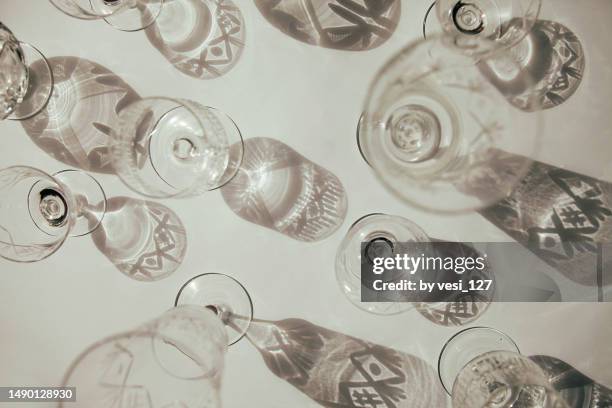 abstract still life with vintage crystal glasses - kristallglas stock-fotos und bilder