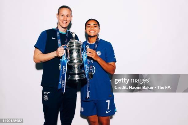 Ann-Katrin Berger and Jess Carter of Chelsea pose with the trophy following her sides victory during the Vitality Women's FA Cup Final match between...