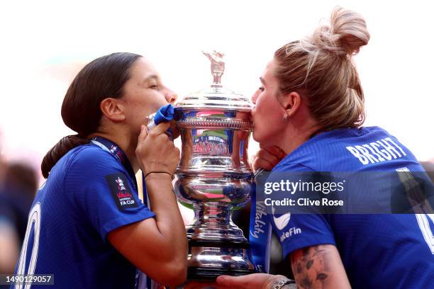 Sam Kerr and Millie Bright of Chelsea kiss the Vitality Women's FA Cup trophy after the team's victory during the Vitality Women's FA Cup Final...