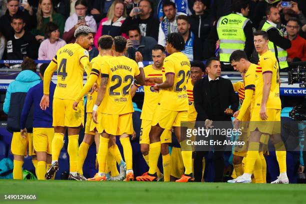 Alex Balde of FC Barcelona celebrates after scoring the team's second goal with teammates during the LaLiga Santander match between RCD Espanyol and...