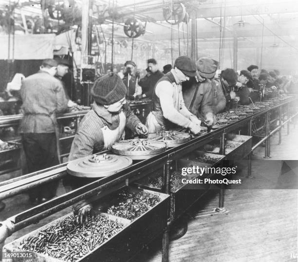 View of assembly line workers in a Ford Motor Company plant, Detroit, Michigan, 1913.