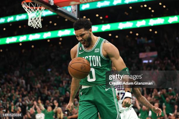 Jayson Tatum of the Boston Celtics celebrates a basket against the Philadelphia 76ers during the first quarter in game seven of the 2023 NBA Playoffs...