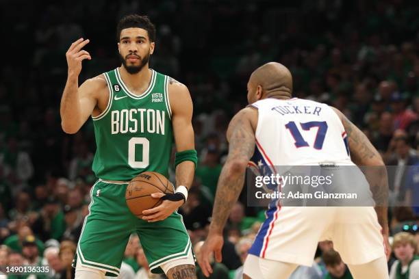 Jayson Tatum of the Boston Celtics signals against P.J. Tucker of the Philadelphia 76ers during the first quarter in game seven of the 2023 NBA...