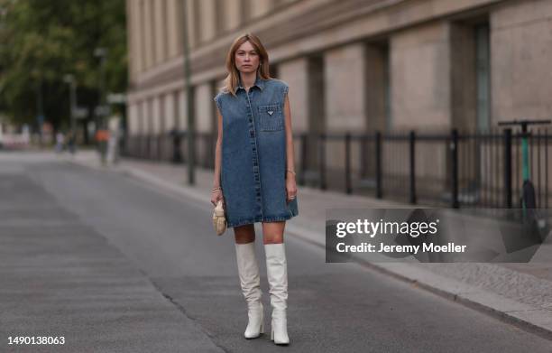 Nadine Berneis seen wearing Prada blue denim midi logo dress, Zara beige over knee boots, Bottega Veneta mini Jodie porridge beige leather bag on May...