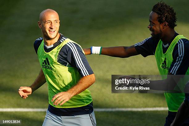 Kei Kamara and Aurelien Collin of the Sporting KC warm up before the game against the New England Revolution at Livestrong Sporting Park on July 21,...
