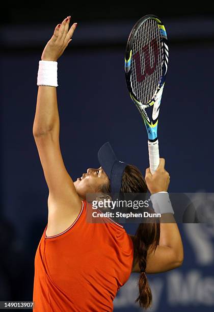 Yung-Jan Chan of Taipei serves to Marion Bartoli of France in their semifinal match during day eight of the Mercury Insurance Open Presented By...