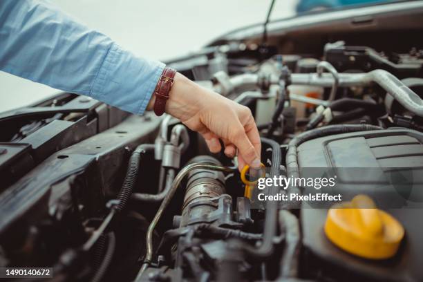 checking her car oil - engine failure stock pictures, royalty-free photos & images