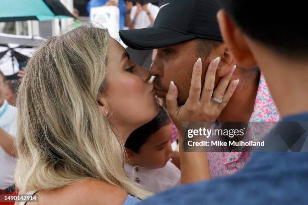 Jason Day of Australia and wife Ellie Day celebrate after Day finished his round during the final round of the AT&T Byron Nelson at TPC Craig Ranch...