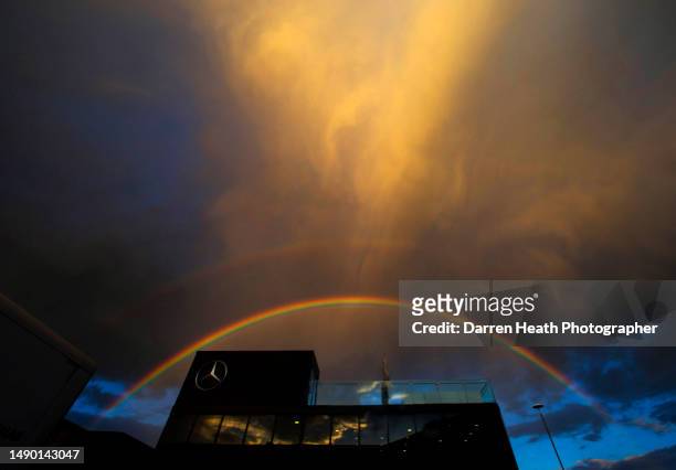 Dramatic sky and multi coloured rainbow over the Mercedes-AMG Formula One paddock based hospitality unit at the 2014 British Grand Prix, Silverstone,...