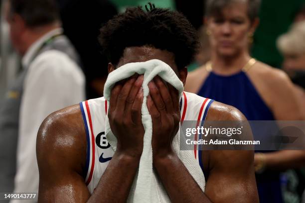 Joel Embiid of the Philadelphia 76ers reacts on the bench against the Boston Celtics during the third quarter in game seven of the 2023 NBA Playoffs...